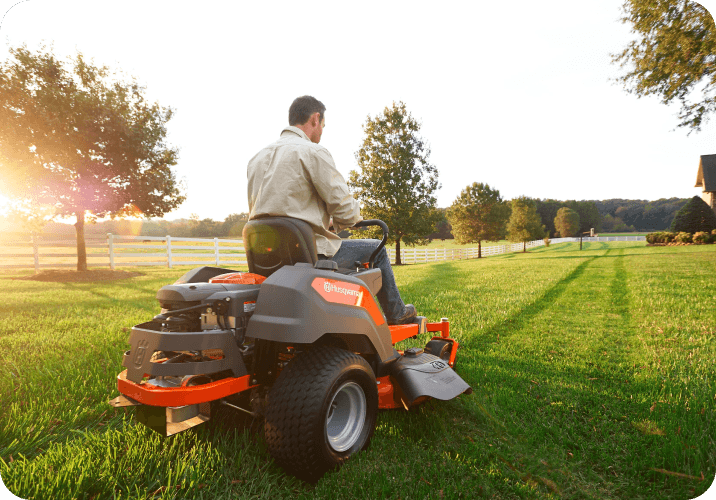 Man on ride on lawn mower